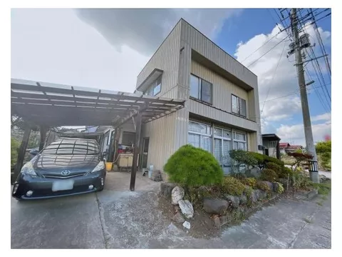 South-facing with good sunlight, includes a carport for one vehicle.