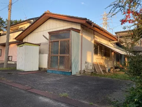 A detached house located in a rugged residential area.