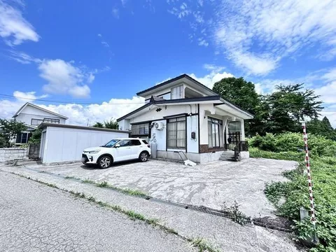 A two-story 5DK home with all rooms over 6 tatami mats, featuring a connected Japanese-style room and a veranda for versatile use.