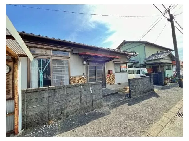 This highly visible single-story home along a main road is also suitable for business.