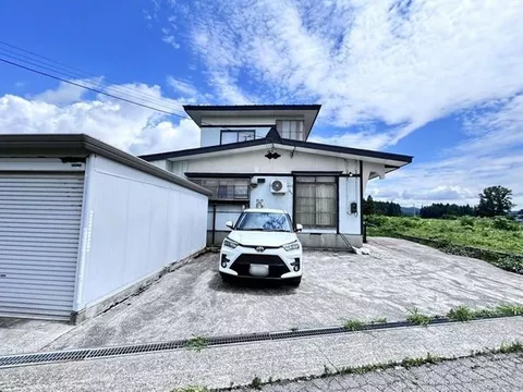 A two-story 5DK home with all rooms over 6 tatami mats, featuring a connected Japanese-style room and a veranda for versatile use. - Image 2