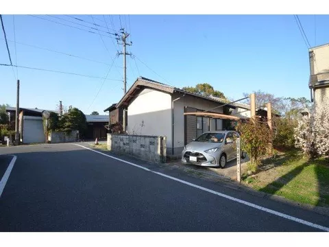 This is a single-story house located in a quiet residential area.