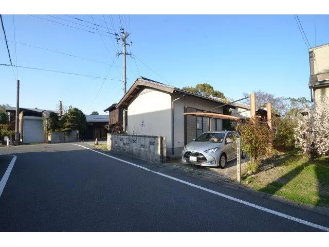 This is a single-story house located in a quiet residential area.