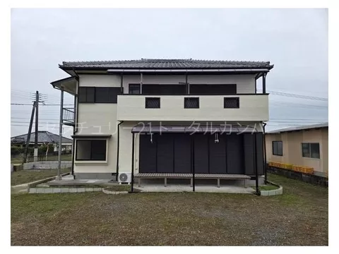 Spacious lot with a large parking space, a two-family house.