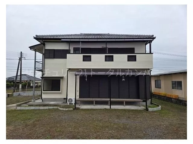 Spacious lot with a large parking space, a two-family house.