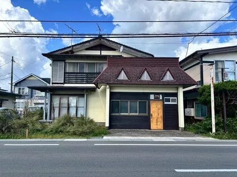 Next to bus stop, residential property with store