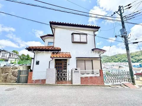 Enjoy the view from the terrace deck that spreads across a quiet residential area on a high ground!