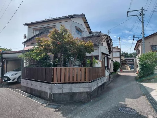 This is a compact 3K used house with a shuttered garage.