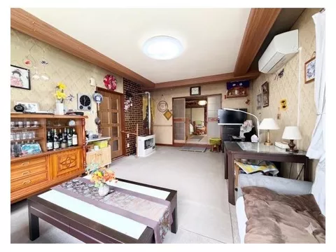 A two-story building that can be used for various purposes such as residence, vacation rental, or studio.