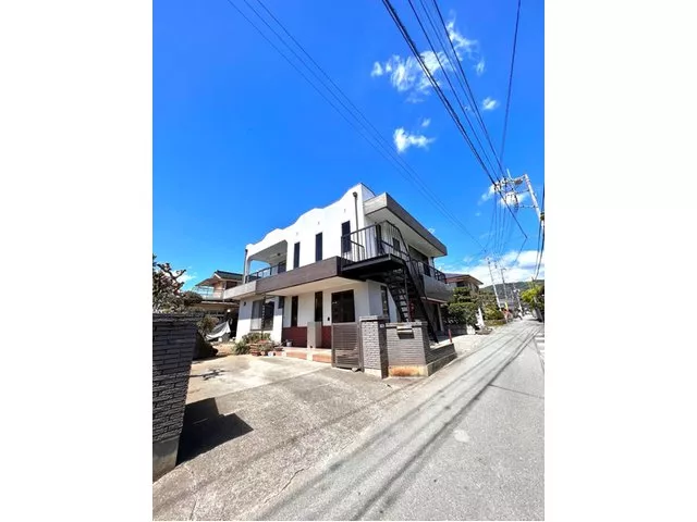 This is an owner-change property. It consists of a large detached house and two neighboring houses.
