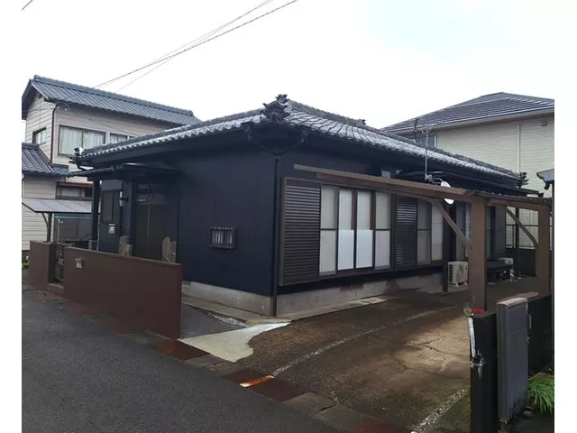 Single-story house, exterior has been painted, interior has been partially renovated, garden converted to parking (for 2 cars)