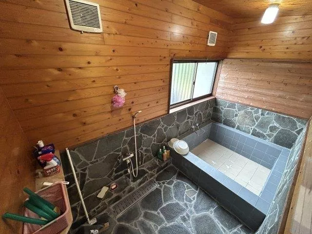 The luxury of enjoying a drink after a bath in a quiet living room.