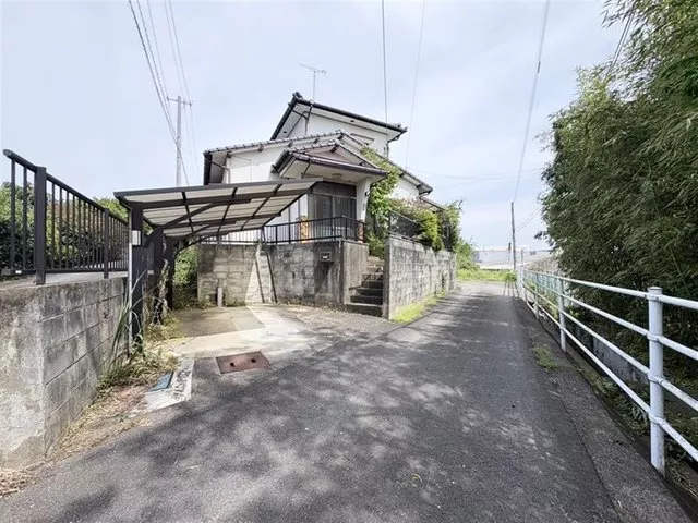 This is a corner house in a quiet residential area.